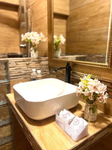 a bathroom with a white sink and a mirror at Montreal Magdalena Del Mar Hotel in Lima