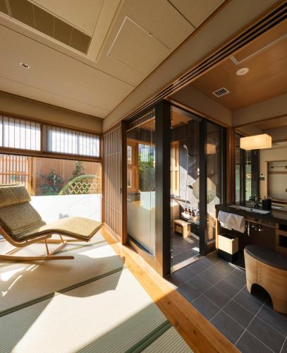 a room with a view of a kitchen and a living room at Onomichi Hansei in Onomichi