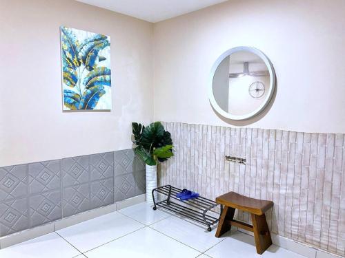 a bathroom with a stool and a mirror at KSL D'Esplanade Apartment Suites by SC Homestay in Johor Bahru
