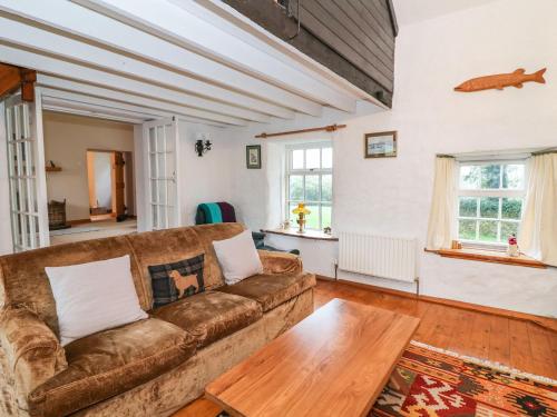 a living room with a couch and a table at Ballintlea in Dungarvan