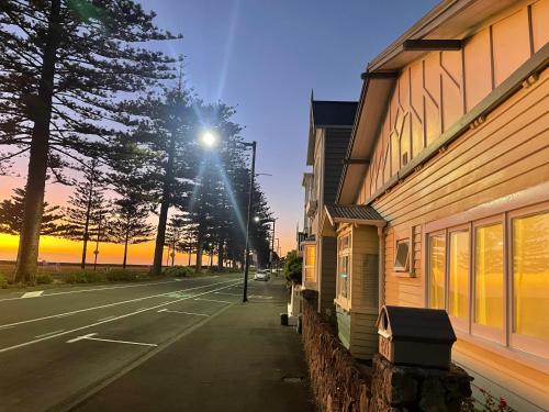 a street with a street light next to a building at Beach Front Cottage Napier in Napier