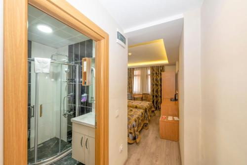 a bathroom with a shower and a sink in a room at Hotel Devman in Istanbul