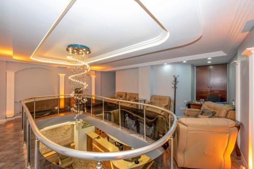 a room with a chandelier and a waiting room at Hotel Devman in Istanbul