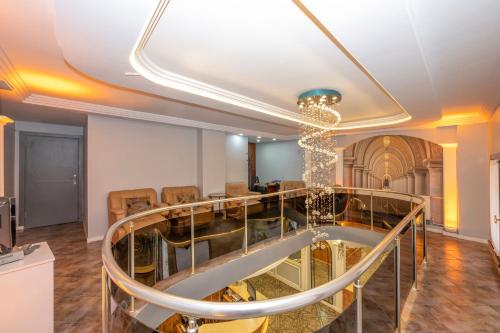 a living room with a chandelier on the ceiling at Hotel Devman in Istanbul