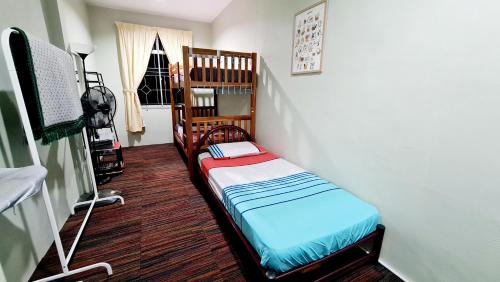 Кровать или кровати в номере EA Homestay Lembah Bujang Merbok
