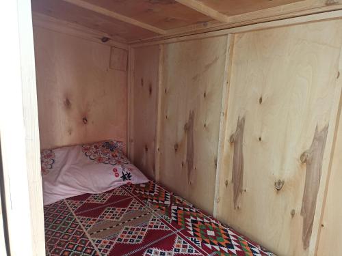 a small room with a bed in it at Nautilus Capsules in Dahab
