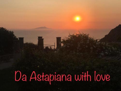 a sunset over the ocean with the sun in the sky at Relais Villa Giusso in Vico Equense