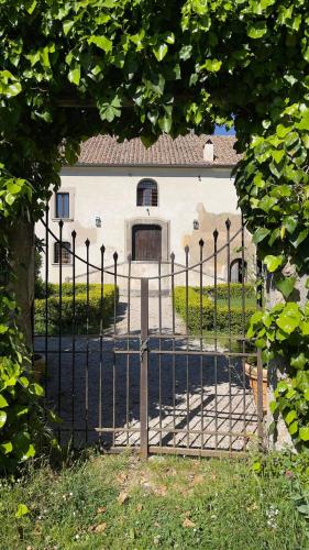 an entrance to a gate to a white house at Relais Villa Giusso in Vico Equense