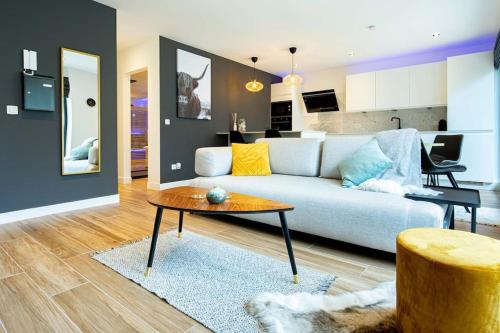 a living room with a couch and a table at Luxury Loft in Antwerp