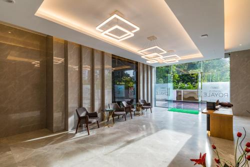 a lobby of a hotel with chairs and tables at AR Suites Jewels Royale - Koregaon Park NX in Pune