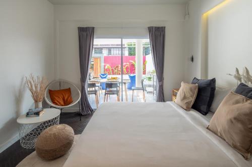 Ένα ή περισσότερα κρεβάτια σε δωμάτιο στο Chala At Nimman