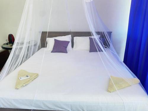 Postel nebo postele na pokoji v ubytování Liyanage Resort
