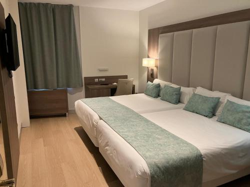 Postel nebo postele na pokoji v ubytování Hotel Selu
