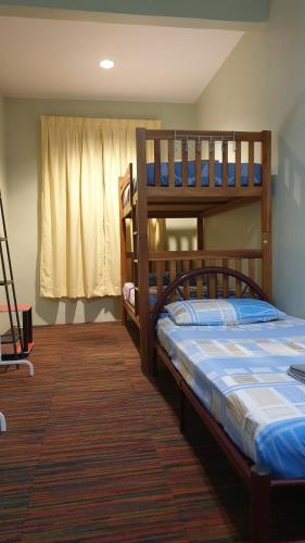Кровать или кровати в номере EA Homestay Lembah Bujang Merbok