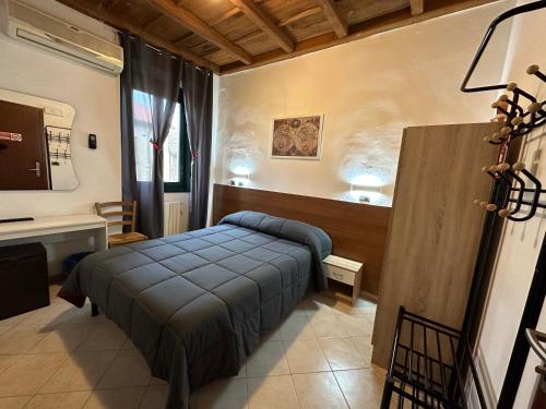 a bedroom with a bed and a sink in a room at Hotel Duca di Tromello in Tromello