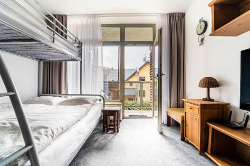 Postel nebo postele na pokoji v ubytování Apartmán Harrachov 608