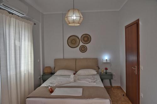 Posteľ alebo postele v izbe v ubytovaní Lagouvardos Apartments