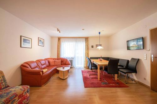 a living room with a couch and a table at Haus Hubertus in Mieders