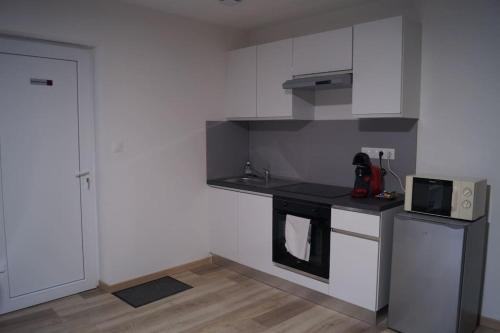 Dapur atau dapur kecil di Appart' spa privatif Gray