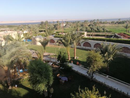 an aerial view of a park with palm trees at Zad El Mosafer Guest House in Tunis