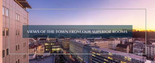 a sign that reads views of the town from our superior rooms at Hotel Continental in Brno