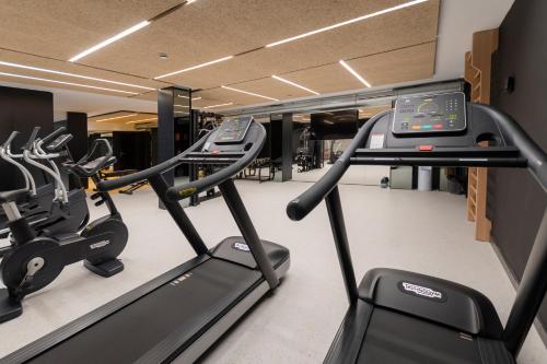 a gym with two treadmills and a treadmill at Hotel Palacio La Marquesa 4 Estrellas SUP in Teruel