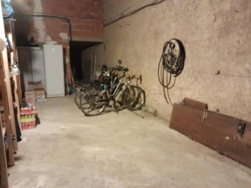 a group of bikes parked in a garage at La pause sous le pin in Capestang