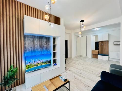a living room with a large aquarium on the wall at Altheda Living Topaz 29C-14 in Sfîntu Ilie