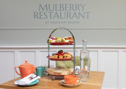 a table with a tray of food on top at Heacham Manor Hotel in Hunstanton