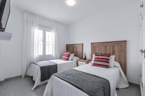 Giường trong phòng chung tại VILLAS NEW LANZASUITES PLUS