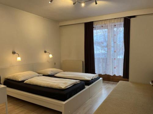 מיטה או מיטות בחדר ב-Landhaus St.Hubertus