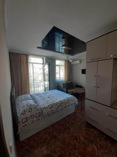 A bed or beds in a room at black sea apartment