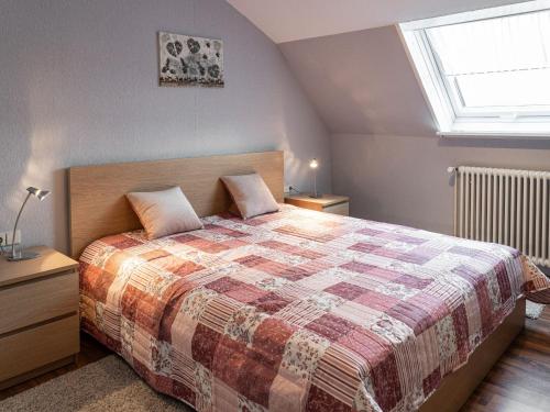 a bedroom with a large bed and a window at Kunibert, 120 qm in Stockach