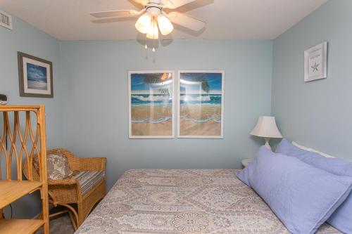 a bedroom with a bed and a ceiling fan at ROYAL GARDEN RESORT 408 condo in Myrtle Beach