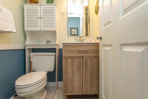 a bathroom with a white toilet and a sink at ROYAL GARDEN RESORT 408 condo in Myrtle Beach