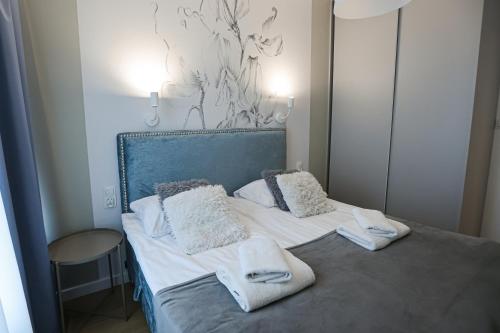 Posteľ alebo postele v izbe v ubytovaní M&K Apartamenty Morska Fala, Gdańsk - Wyspa Sobieszewska