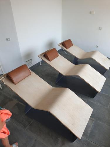 a group of three chairs sitting in a room at Apartamento Rokita Blanca in La Manga del Mar Menor