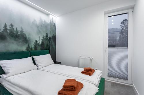 Posteľ alebo postele v izbe v ubytovaní Z Widokiem Apartamenty Świerkowe 10