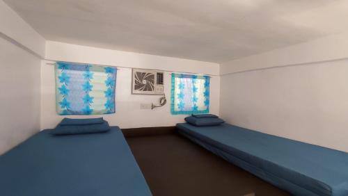 Postel nebo postele na pokoji v ubytování Ezekiel Transient House