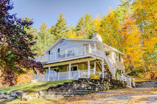 a house on a hill in the woods at Deer Run Retreat in Gilford