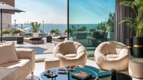 a living room with two chairs and a table at Crowne Plaza Florya Istanbul by IHG in Istanbul