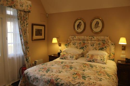 a bedroom with a bed with two pillows at The Granary Lodge Bed & Breakfast in Thurso