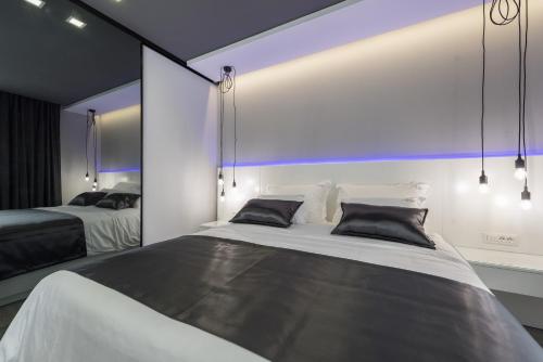 a bedroom with two beds and a large window at Artis Accommodation Lux in Zadar