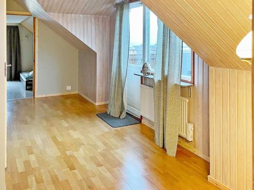 an empty living room with a large window at Holiday home SÖLVESBORG XVI in Sölvesborg