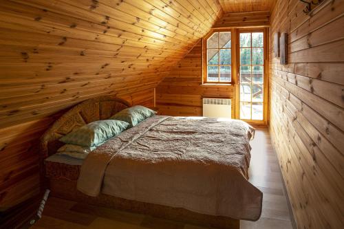 מיטה או מיטות בחדר ב-Guest House Mednieki