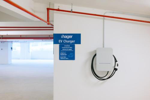 a mirror hanging from a wall in a parking garage at METROPOL SERVICED APARTMENT at Bukit Mertajam, Pulau Pinang in Bukit Mertajam
