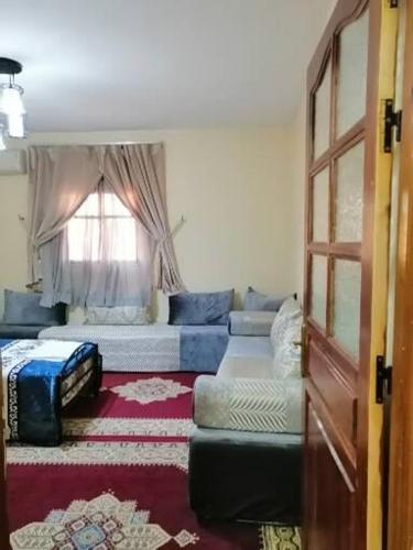 a living room with a couch and a window at Takad Dream Rural in Takate