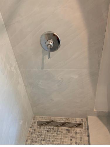 a bathroom with a shower with a drain at Bedroom and Bathroom 4 in Boca Raton
