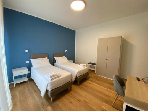 Postel nebo postele na pokoji v ubytování FORESTERIA DANSI