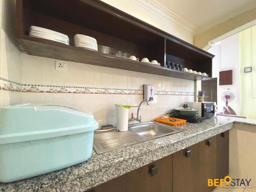 a kitchen with a sink and a counter top at Afamosa Villa with private pool by BeeStay in Kampong Alor Gajah